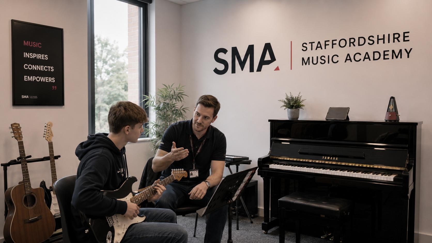 Music tutor giving a one-to-one lesson to a student